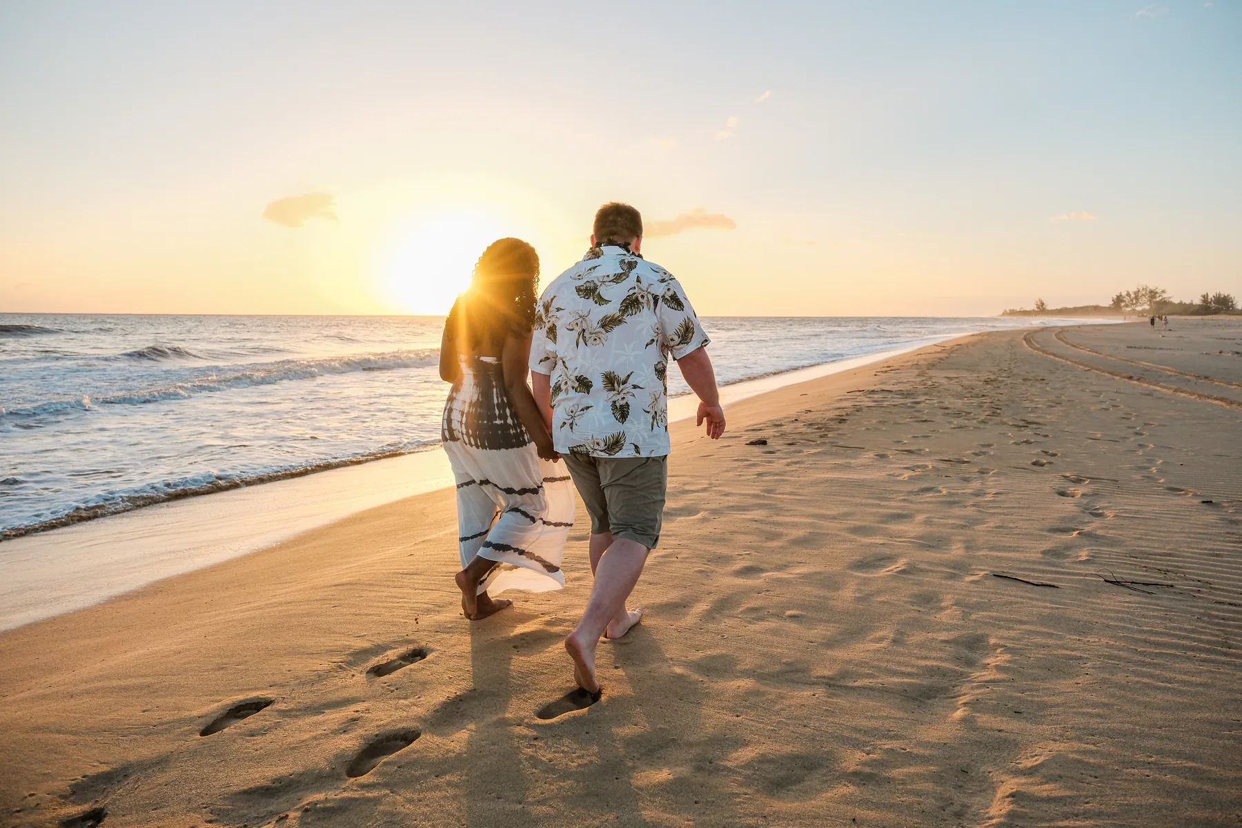 Couple walking at sunset